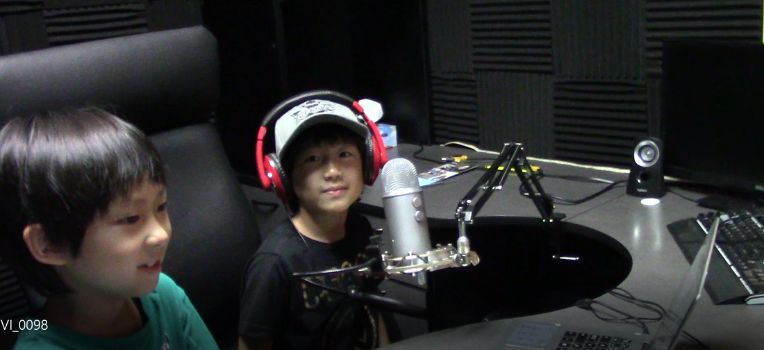 2 boys in voice studio.