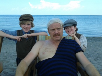 William Healy and Nicholas Healy are on the set of the TV program Murdoch Mysteries along side Thomas Craig an English actor known for his roles in Murdoch Mysteries, Coronation Street, and The Navigators.